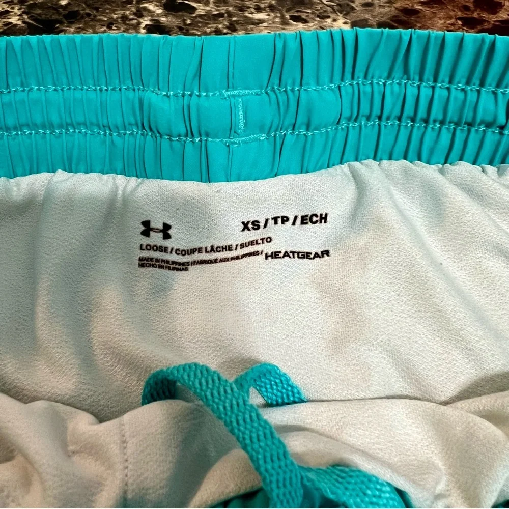 Under Armor Ladies Running Shorts w/inside. Vented‎ sides for airflow. Size-XS